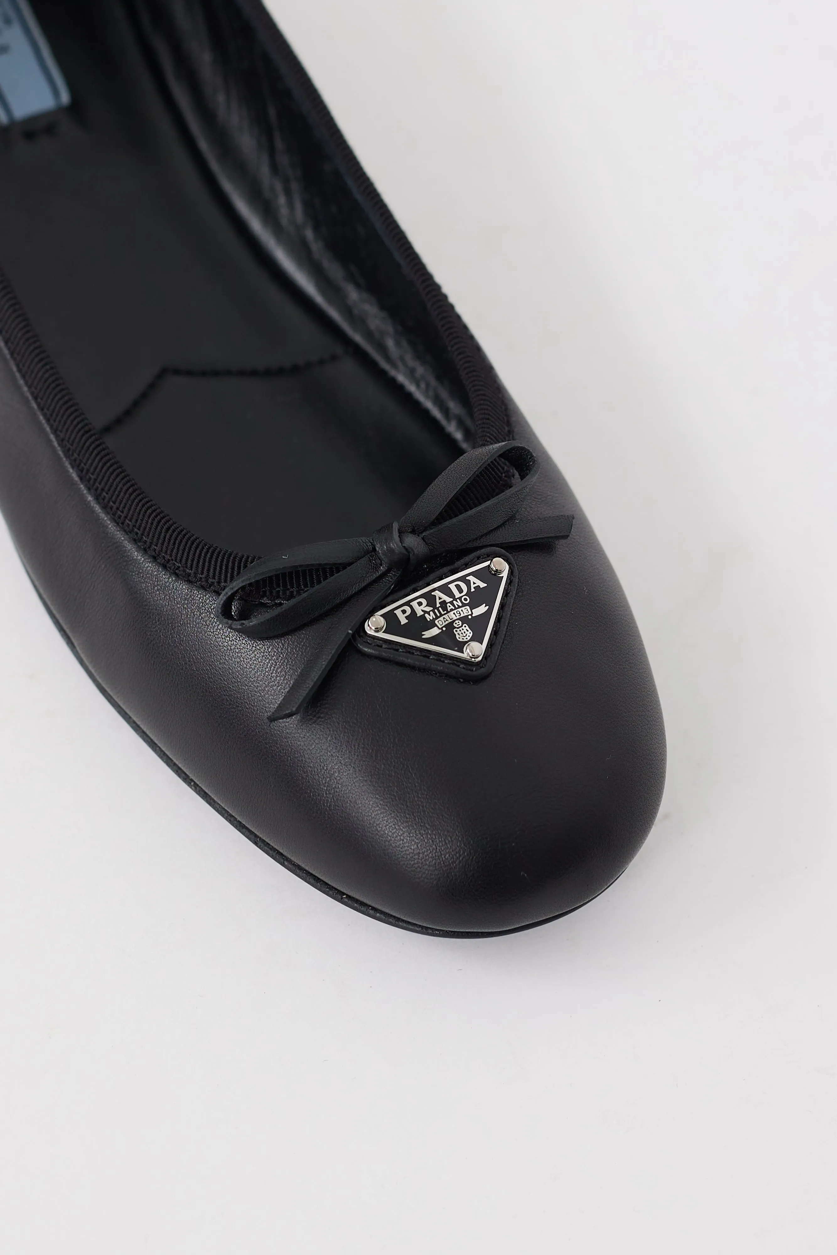Black Leather Triangle Logo Bow Flat